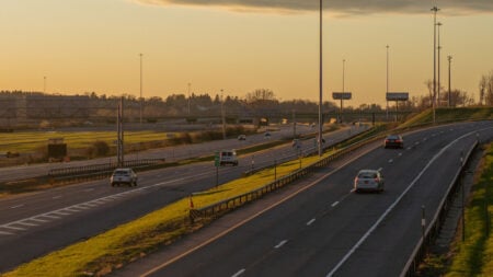 New York Construction Worker Says Boss Told Him to Come In Severely Sick, Then Sent Him Home After 40-Mile Drive: ‘An Authentic American Experience’ A highway in Syracuse, NY at sunset