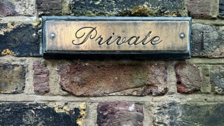 Vermont Building Owner Says Town Drilled Historical Plaque Into His Private Property Without Permission: ‘They Warned Me Not To Remove It’ Brick wall with a plaque that read private
