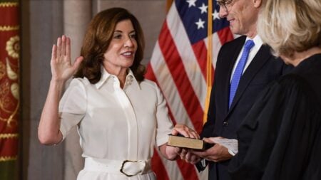 New York Gov. Kathy Hochul thanked faith leaders and said helping neighbors is how she was raised. On X, the same message quickly turned into a fight over what those values mean in office.