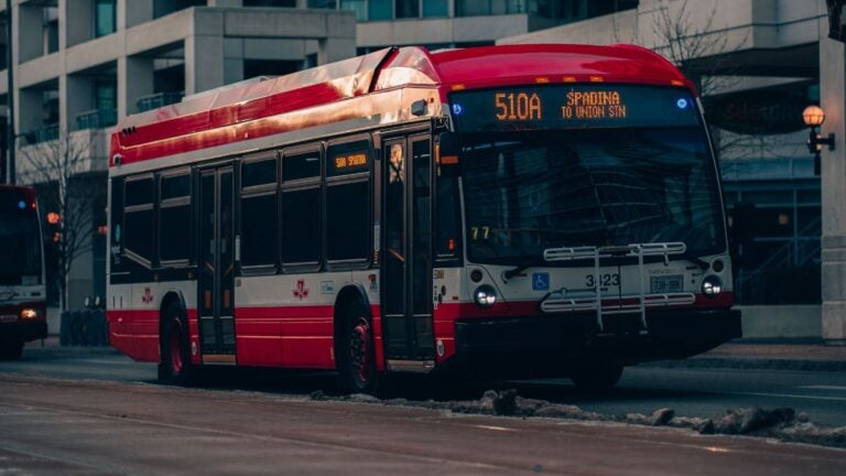 Street view of public buses in downtown Toronto, capturing the urban transportation vibe.