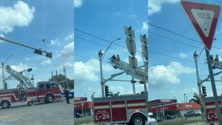 Texas Man Filmed Sitting on Top of Texas Traffic Light: ‘It’s Always Something Stupid Happening Here’ Man sitting on traffic light while firefighters approach.