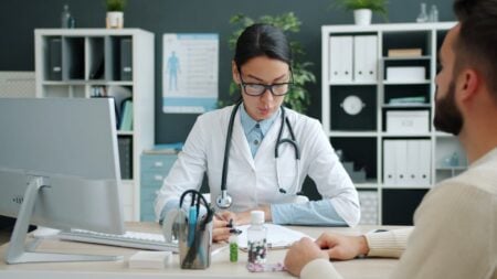 ‘Rural Hospitals Are in Danger of Closing’: Pennsylvania Locals Fear Fallout as 8,000 Residents Lose Medicaid A female doctor consulting a patient in a modern office setting.
