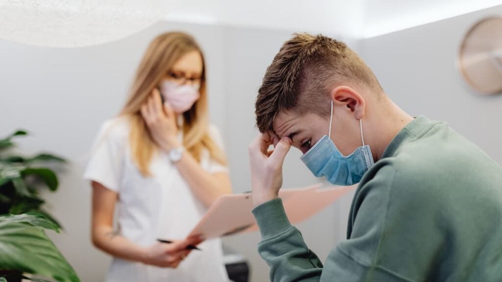 ‘Why Kick People When They Are Down?’: 14,000 Worried North Carolina Residents Lose Medicaid Coverage Today A worried patient discusses with a healthcare professional in a medical office setting.