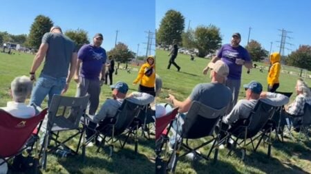 Sideline view of a West Virginia youth soccer game, with adults seated in folding chairs as children play on the field.