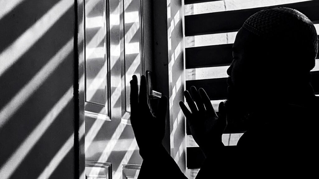 Ohio Couple Says Doorbell Camera Caught Landlord Secretly Entering Their Apartment Four Times: ‘Something Is Giving Predator Vibes’ Black and white image of a man in silhouette