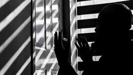 Ohio Couple Says Doorbell Camera Caught Landlord Secretly Entering Their Apartment Four Times: ‘Something Is Giving Predator Vibes’ Black and white image of a man in silhouette