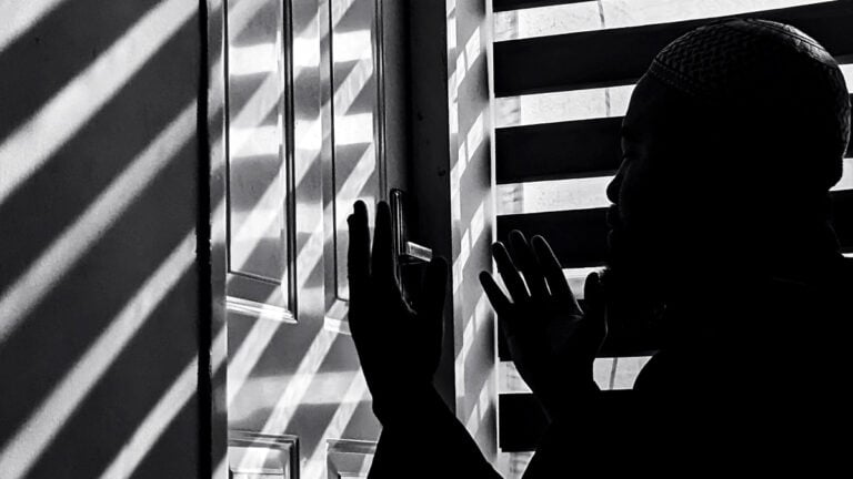 Black and white image of a man in silhouette