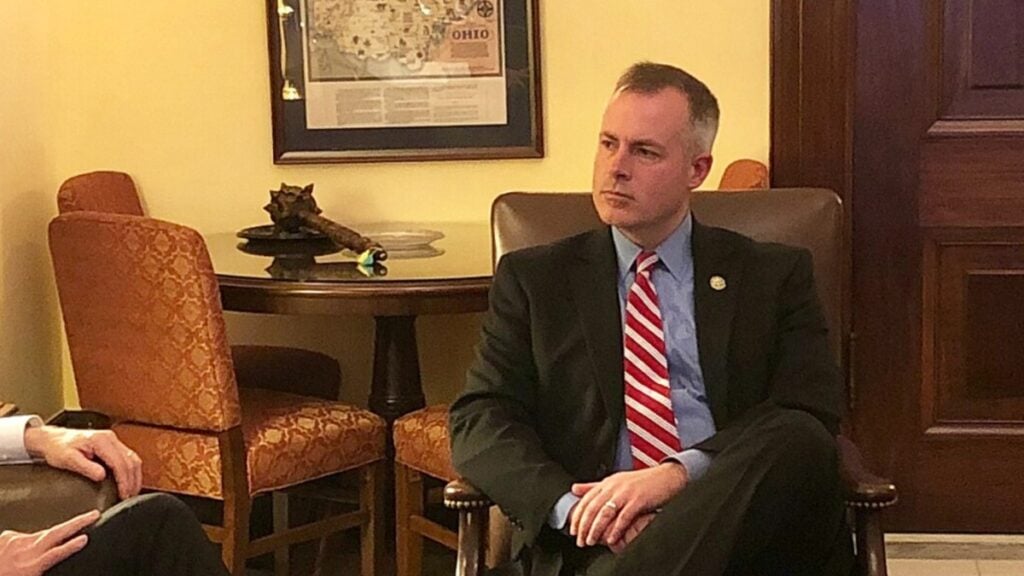 Ohio Treasurer Robert Sprague filmed himself at a Mansfield Speedway and credited Republican leadership for a 44-cent drop in state gas prices. Replies called the boast a temporary stunt, while drivers welcomed the lower pump price.