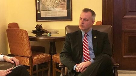Ohio Treasurer Robert Sprague filmed himself at a Mansfield Speedway and credited Republican leadership for a 44-cent drop in state gas prices. Replies called the boast a temporary stunt, while drivers welcomed the lower pump price.