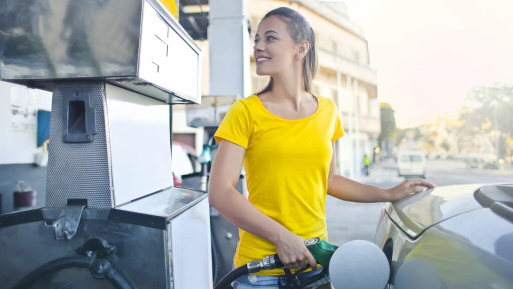 ‘A Joke or a Slap in the Face?’: Michigan Residents Scoff at Mike Rogers’ Wife’s $10 Gas Card Giveaway Woman Filling Car with Gas