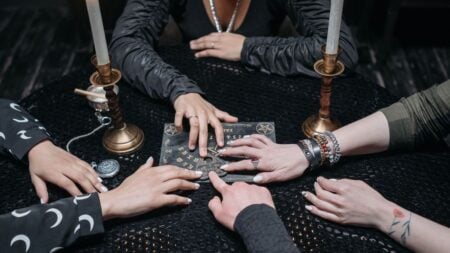 Florida Evangelist Declares Chipotle ‘Evil’ Over Halloween Ad, Accuses Chain of ‘Summoning Spirits’: ‘Get a New Hobby, Ma’am’ Photo of hand on ouija board