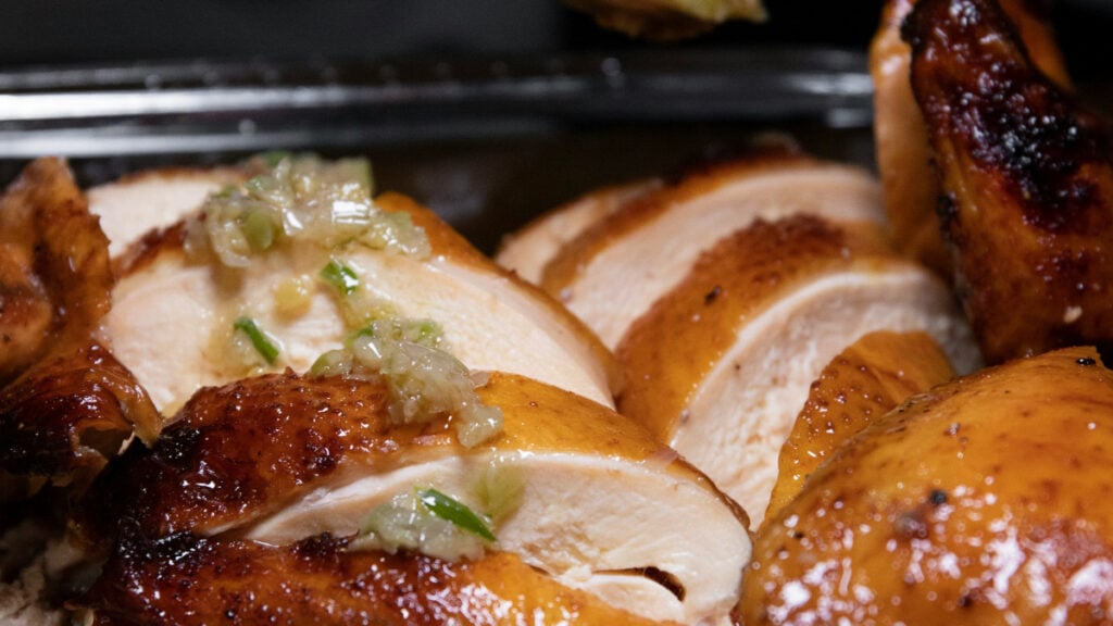 ‘Why Do We Need To Drag Race Into It?’: California Woman Says Security Kicked Her From Parking Lot for Eating Chicken She Just Bought Baked chicken on a tray