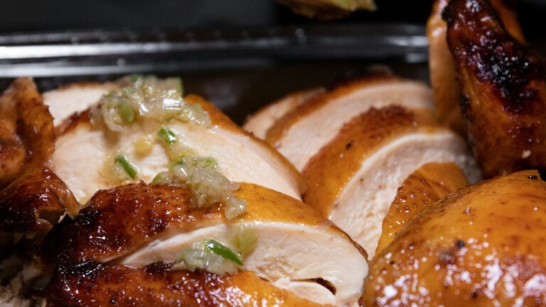 ‘Why Do We Need To Drag Race Into It?’: California Woman Says Security Kicked Her From Parking Lot for Eating Chicken She Just Bought Baked chicken on a tray