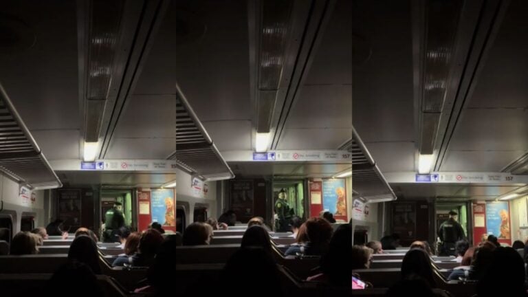 Inside of a stopped subway car.